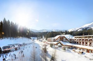Zaśnieżona wioska górska z hotelami. Traveligo Blog