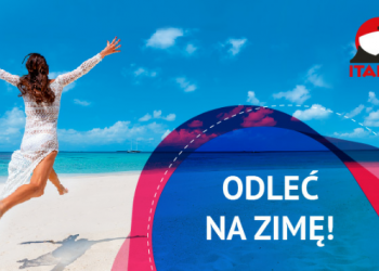 Kobieta w białej sukience skacząca na plaży. Traveligo Blog