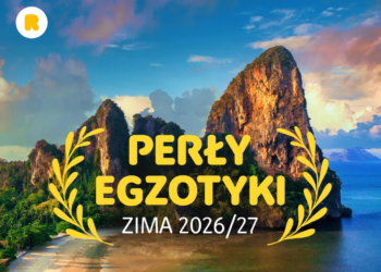 Perły Egzotyki Zima 2026/27 – tropikalna plaża z wysokimi wapiennymi skałami nad turkusowym morzem, grafika promocyjna Rainbow Tours