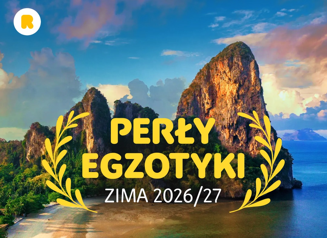 Perły Egzotyki Zima 2026/27 – tropikalna plaża z wysokimi wapiennymi skałami nad turkusowym morzem, grafika promocyjna Rainbow Tours
