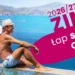 Wakacje zimą 2026/2027 nad morzem – para relaksująca się przy basenie infinity z widokiem na ocean